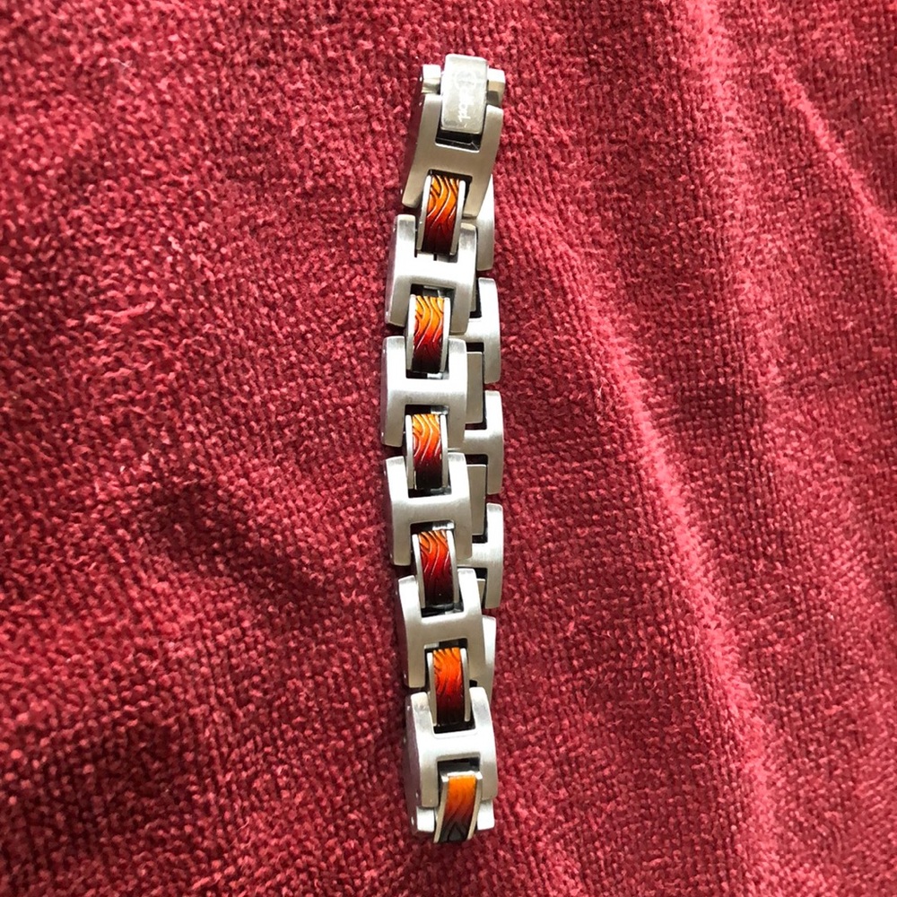 Men’s stainless steel and wood inlay bracelet.